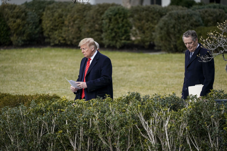 WASHINGTON, DC - JANUARY 29: (L-R) US President Donald Trump, Vice President Mike Pence and US Trade Representative Robert Lighthizer arrive at a signing ceremony for the US-Mexico-Canada Trade Agreement at South Lawn of the White House on January 29th. January 29, 2020 in Washington, DC. The new United States-Mexico-Canada Agreement (USMCA) will replace the 25-year-old North American Free Trade Agreement (NAFTA) with provisions aimed at strengthening the US auto manufacturing industry. . The signing of the USMCA is considered one of President Trump's biggest legislative achievements since Democrats took control of the House in 2018. (Photo by Drew Angerer/Getty Images)